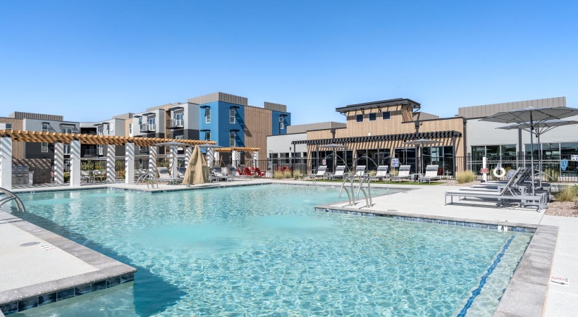 a swimming pool in front of a building