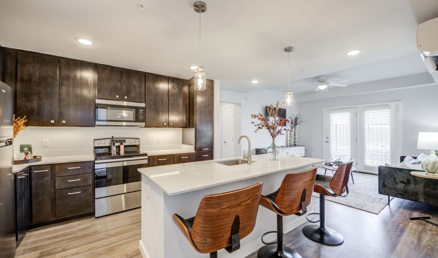 a kitchen with a dining table and chairs