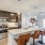 a kitchen with a dining table and chairs
