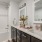 a bathroom with a tub sink and a mirror