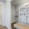 a room with a bed and a shelf with books